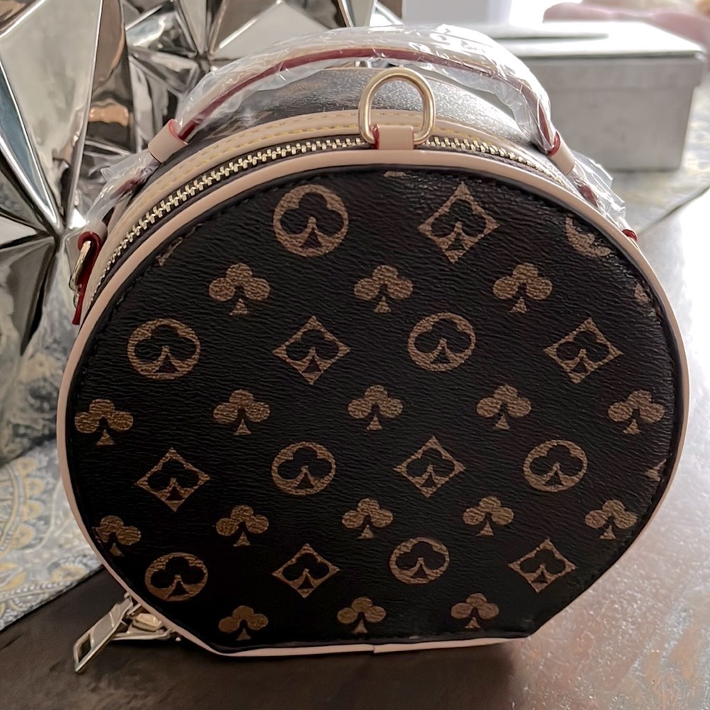 Louis Vuitton circular purse….